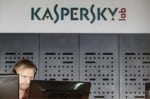 An employee works near screens in the virus lab at the headquarters of Russian cyber security company Kaspersky Labs in Moscow